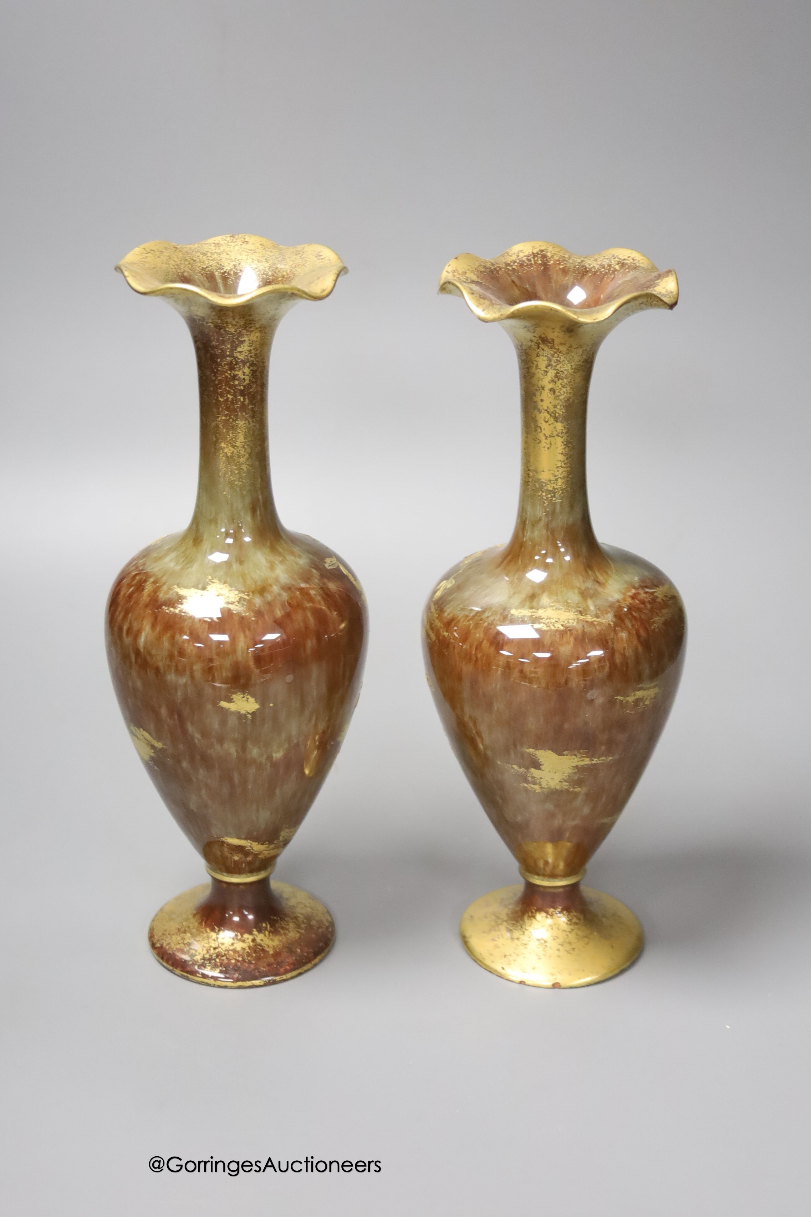 A pair of Forresters Aesthetic period gilded earthenware vases, 27cm